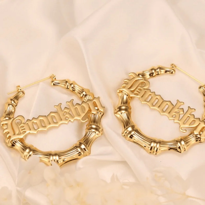 A unique 3-in-1 personalized name bamboo earring and necklace set customized with Halloween decoration inspiration 250214