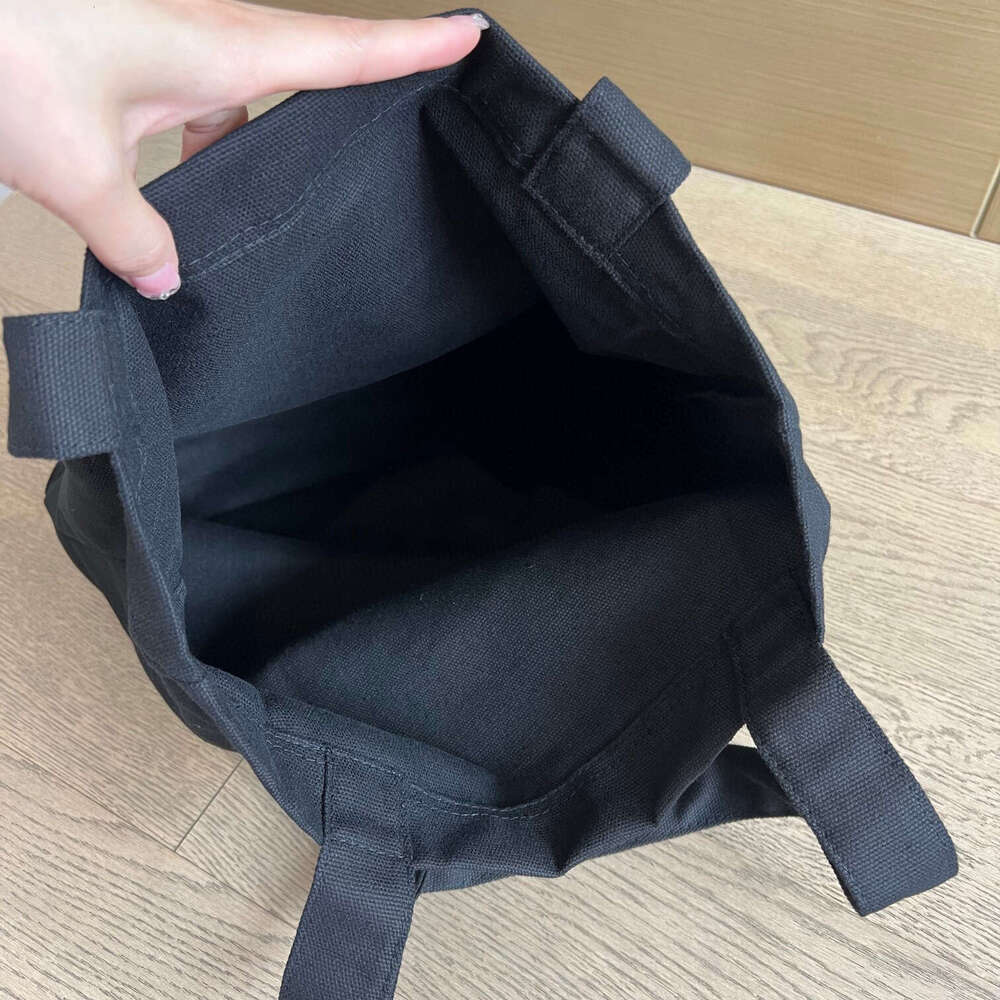 Canvas With White, Black, And Sier Colors. Shopping Bag Can Be Carried On One Shoulder Or By Hand