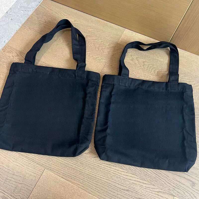 Canvas With White, Black, And Sier Colors. Shopping Bag Can Be Carried On One Shoulder Or By Hand