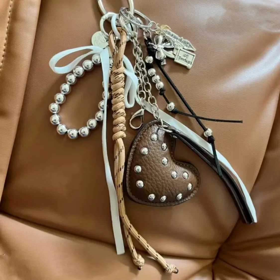 Keychains Lanyards 2025 New Brown Style Movie Cute Heart Extremely Complex Bag Pendant Weaving Rope Ornament Accessories Gift H250217