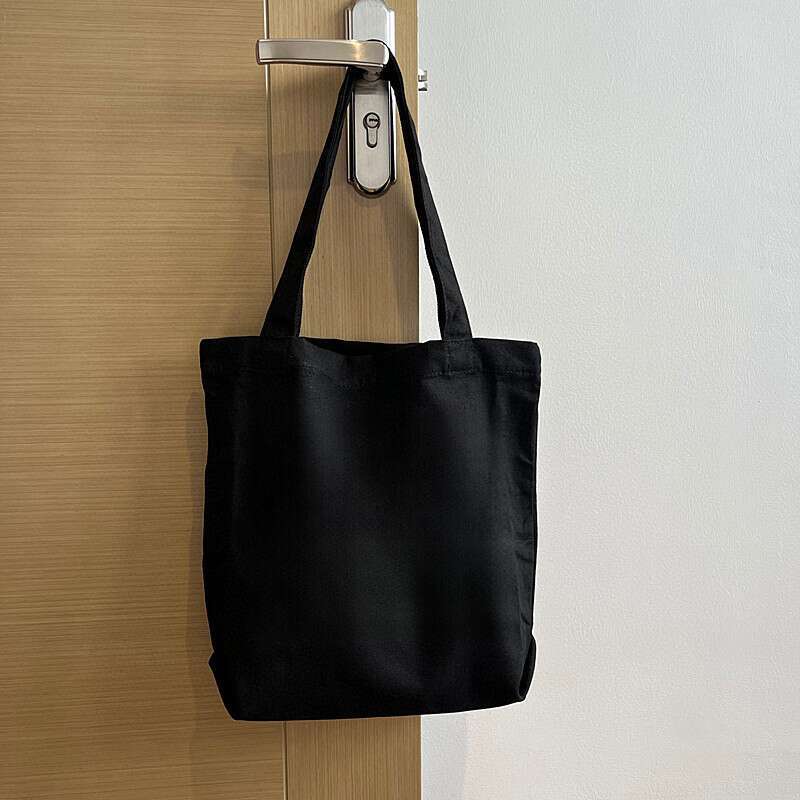 Canvas With White, Black, And Sier Colors. Shopping Bag Can Be Carried On One Shoulder Or By Hand