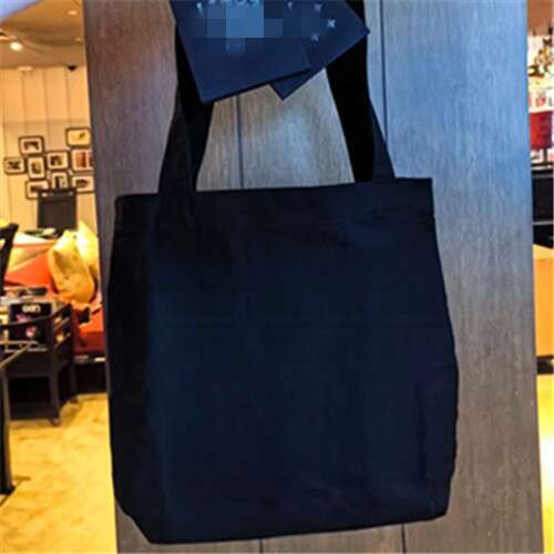 Canvas With White, Black, And Sier Colors. Shopping Bag Can Be Carried On One Shoulder Or By Hand