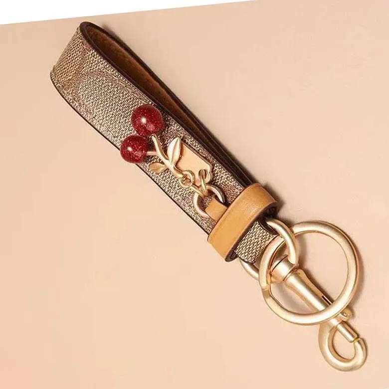 Luxury Keychain Designer Co ch Lovely Tiny Cherry Cute Cherry Key Ring For Women Charm Bag Holder Ornament Pendant Accessories Chains AAA