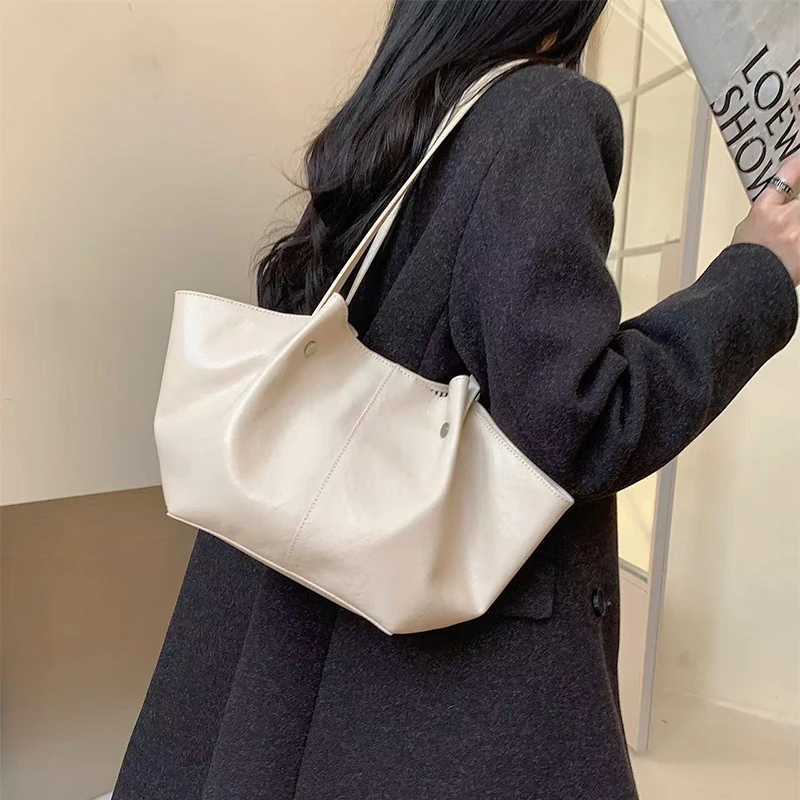 Luxury Tan Cowhide Wing Shoder BagDesigner Large Capacity Genuine Leather Wens Armpit Tote Bag Cmuting Handbag Z250514