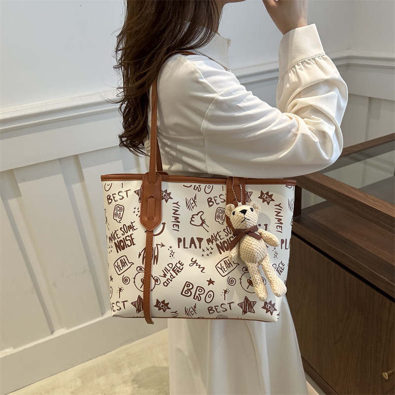 Tote women's large capacity shoulder high-end sense, big bag, 2025 new trendy and niche graffiti class commuting bag #swissmilitary