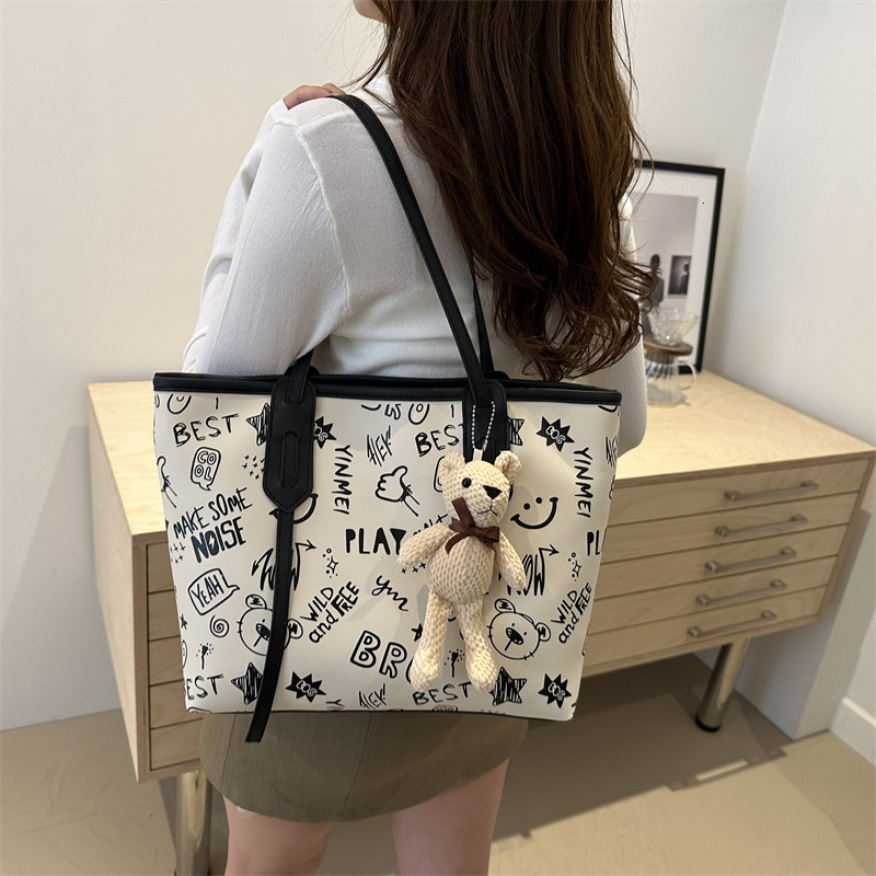 Tote women's large capacity shoulder high-end sense, big bag, 2025 new trendy and niche graffiti class commuting bag #swissmilitary