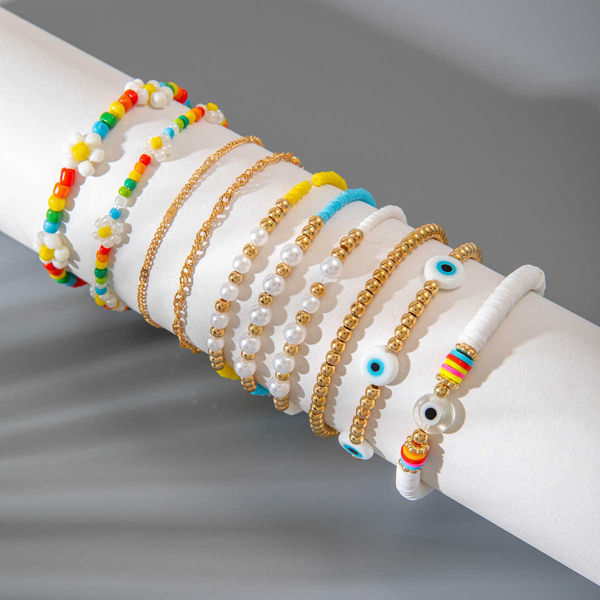 Charm Bracelets Bohemian style colorful rice bead eye ten piece bracelet dopamine elastic bracelet set for women H25220