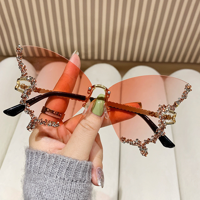 2025 New Foreign Trade Diamond Rimless Butterfly Metal Sunglasses Female Personality Street Photography Trend Decorative Sunglasses