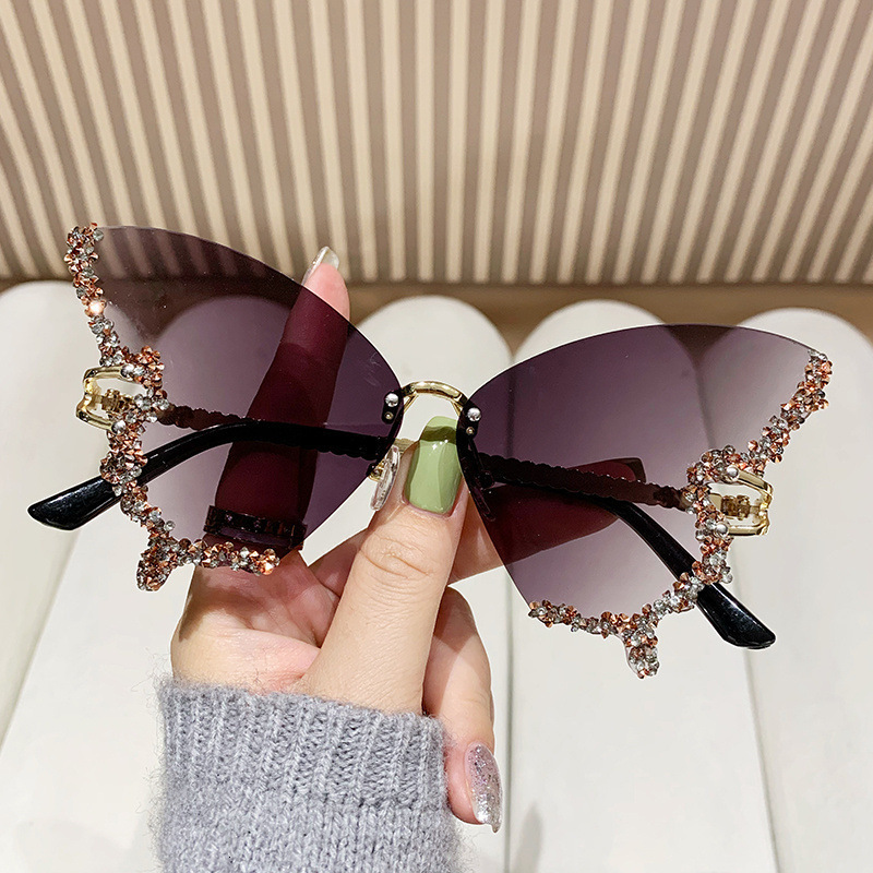 2025 New Foreign Trade Diamond Rimless Butterfly Metal Sunglasses Female Personality Street Photography Trend Decorative Sunglasses
