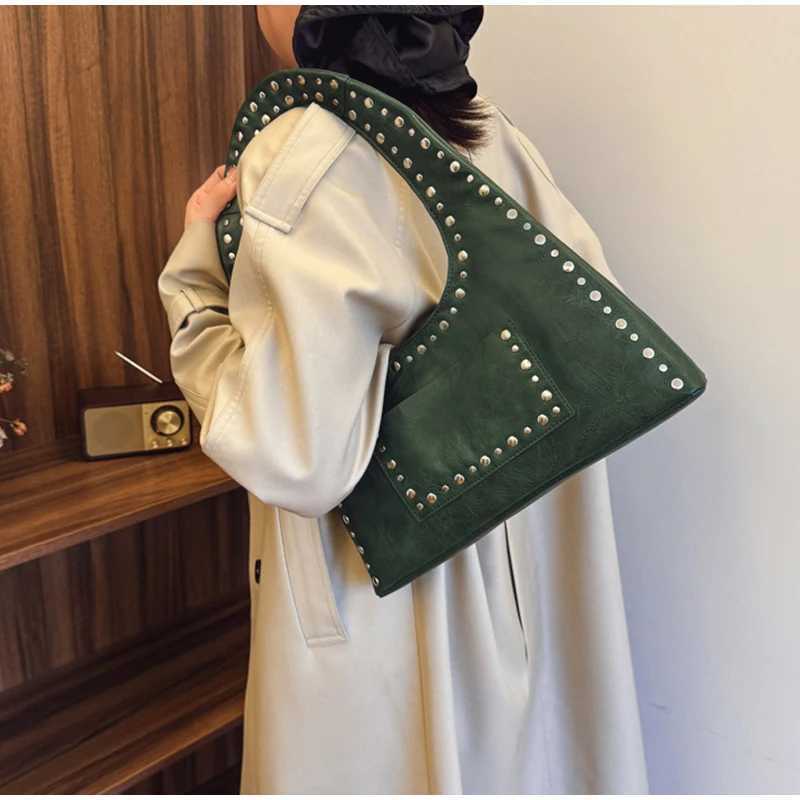 Retro decorative shoulder bag European and American motorcycle style nail wallet leather armrest bag hot womens handbag Y250218
