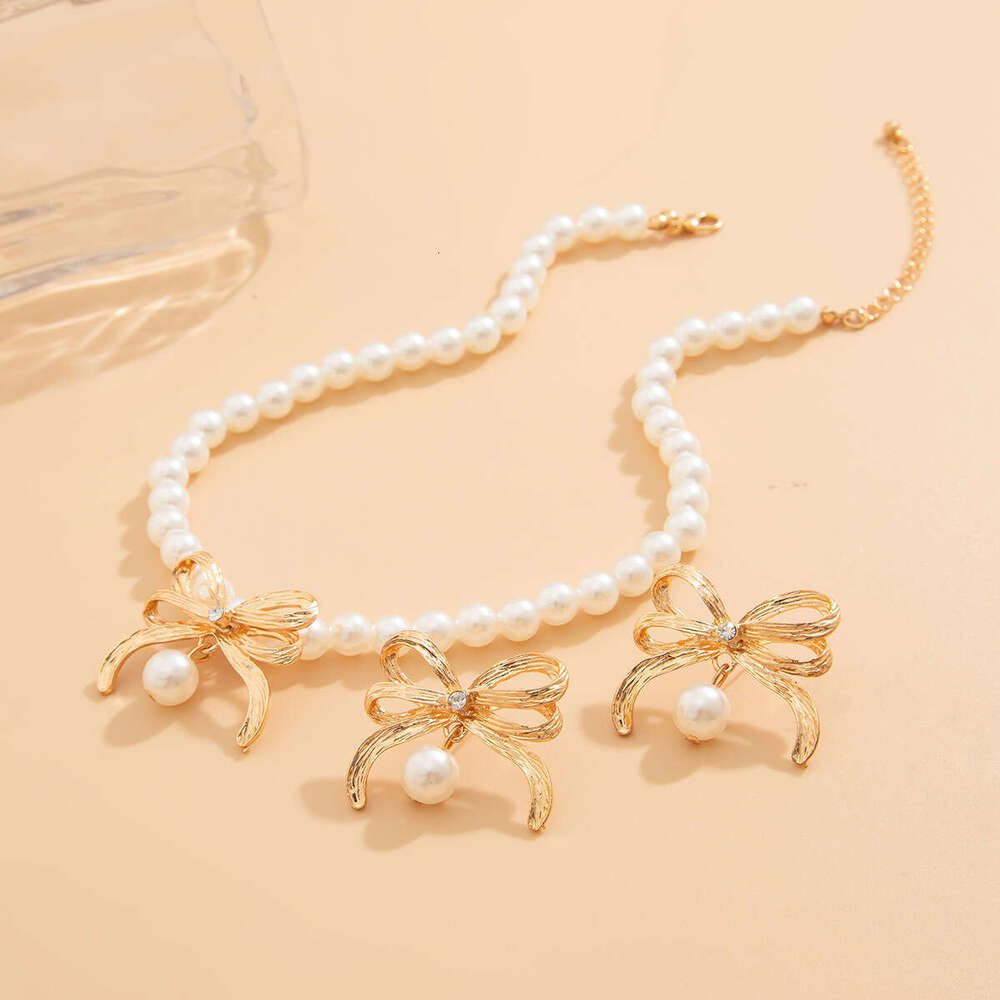 Jewelry fashion imitation pearl bead necklace set, light style alloy bow collarbone chain