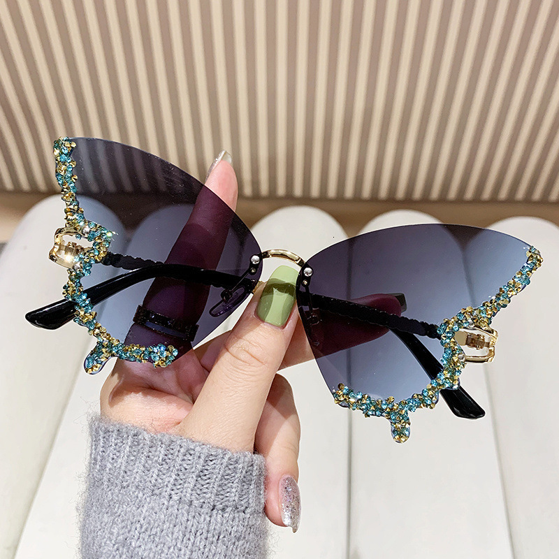 2025 New Foreign Trade Diamond Rimless Butterfly Metal Sunglasses Female Personality Street Photography Trend Decorative Sunglasses