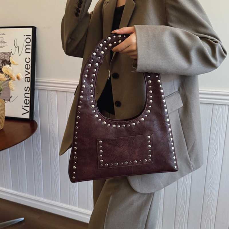 Retro decorative shoulder bag European and American motorcycle style nail wallet leather armrest bag hot womens handbag Y250218