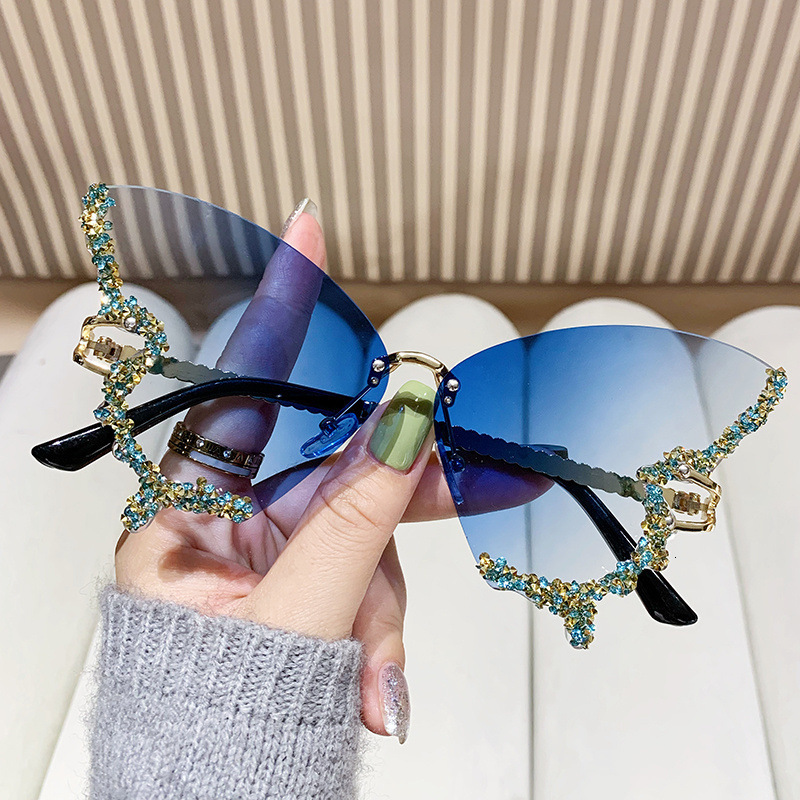 2025 New Foreign Trade Diamond Rimless Butterfly Metal Sunglasses Female Personality Street Photography Trend Decorative Sunglasses