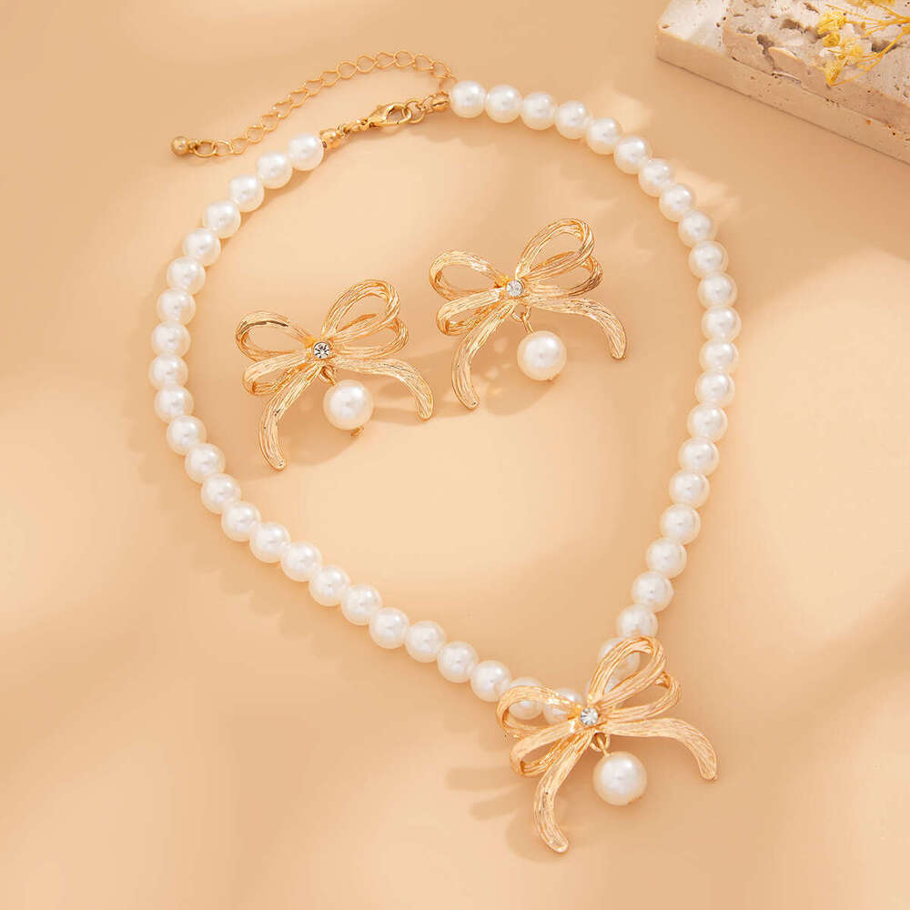 Jewelry fashion imitation pearl bead necklace set, light style alloy bow collarbone chain