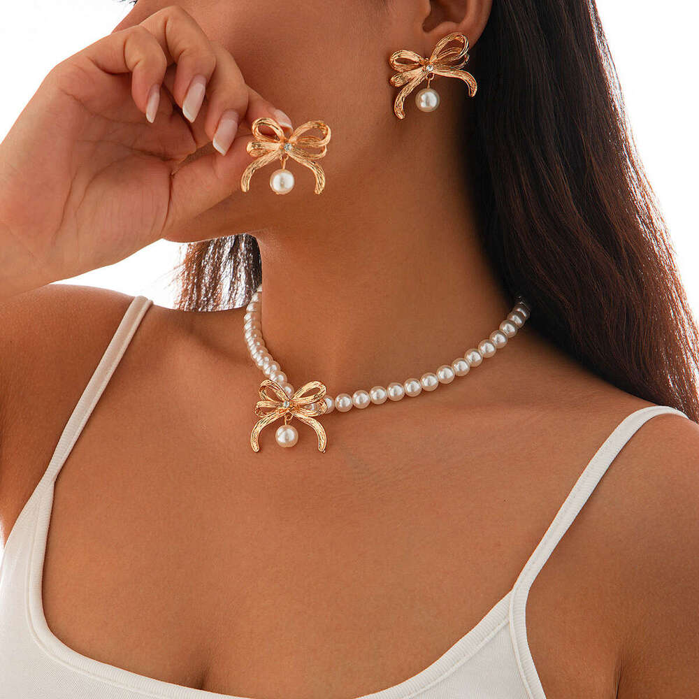Jewelry fashion imitation pearl bead necklace set, light style alloy bow collarbone chain