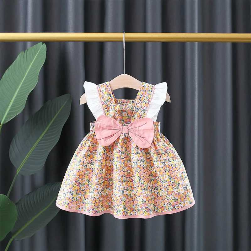 Baby girl floral printed princess dress with white lace on the side and a large bow on the back X250220