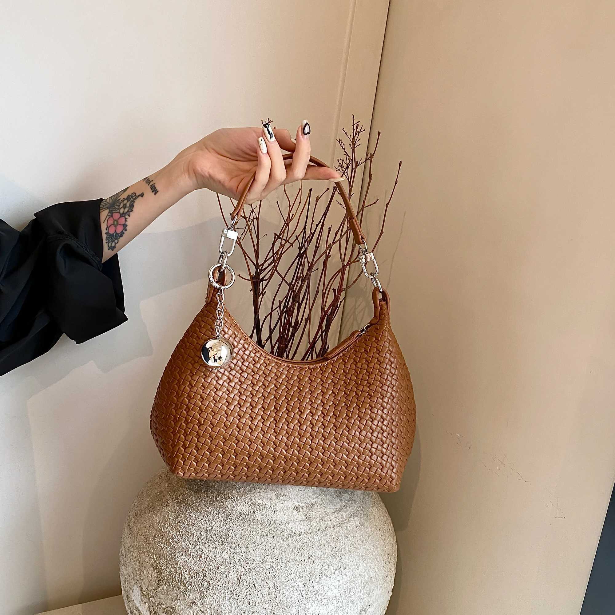 Womens lightweight soft leather woven arm bag new Versatile handheld garbage bag for autumn 2024 high-end horizontal bag Y250319