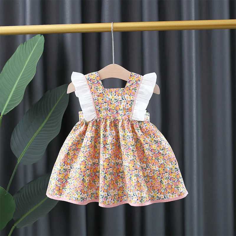 Baby girl floral printed princess dress with white lace on the side and a large bow on the back X250220