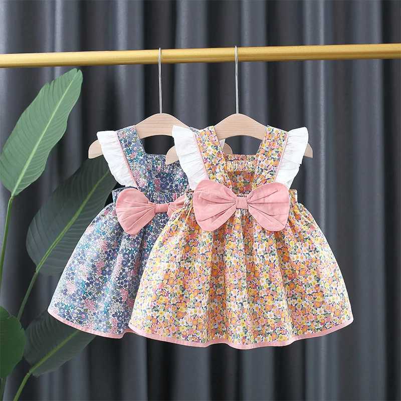 Baby girl floral printed princess dress with white lace on the side and a large bow on the back X250220