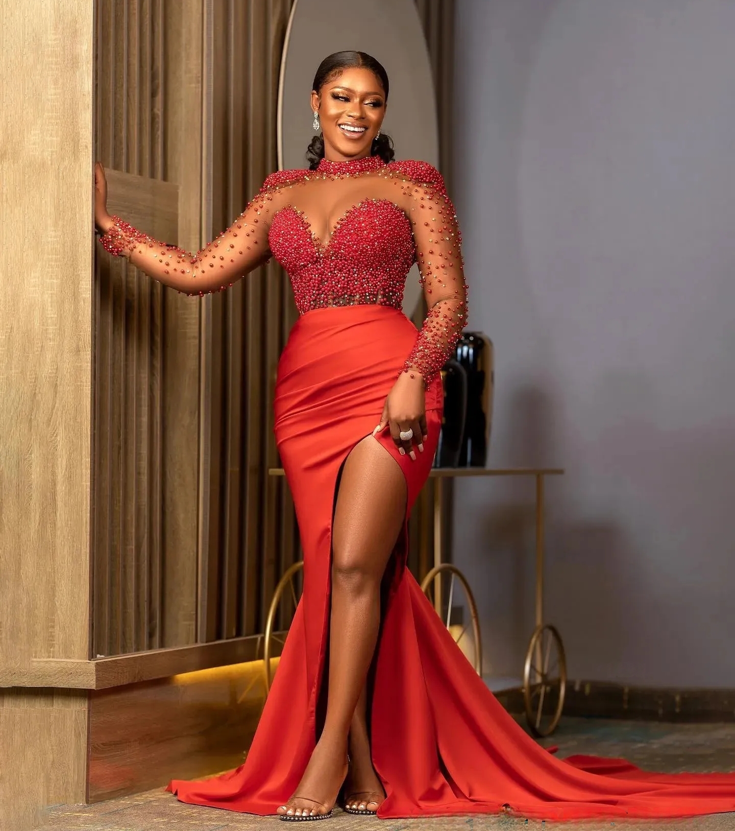 2025 African Red Mermaid Prom Dresses Pearls Beaded Long Sleeves Corset Formal Evening Gowns Transparent Jewel neck Side High Split Sexy Pageant Dress