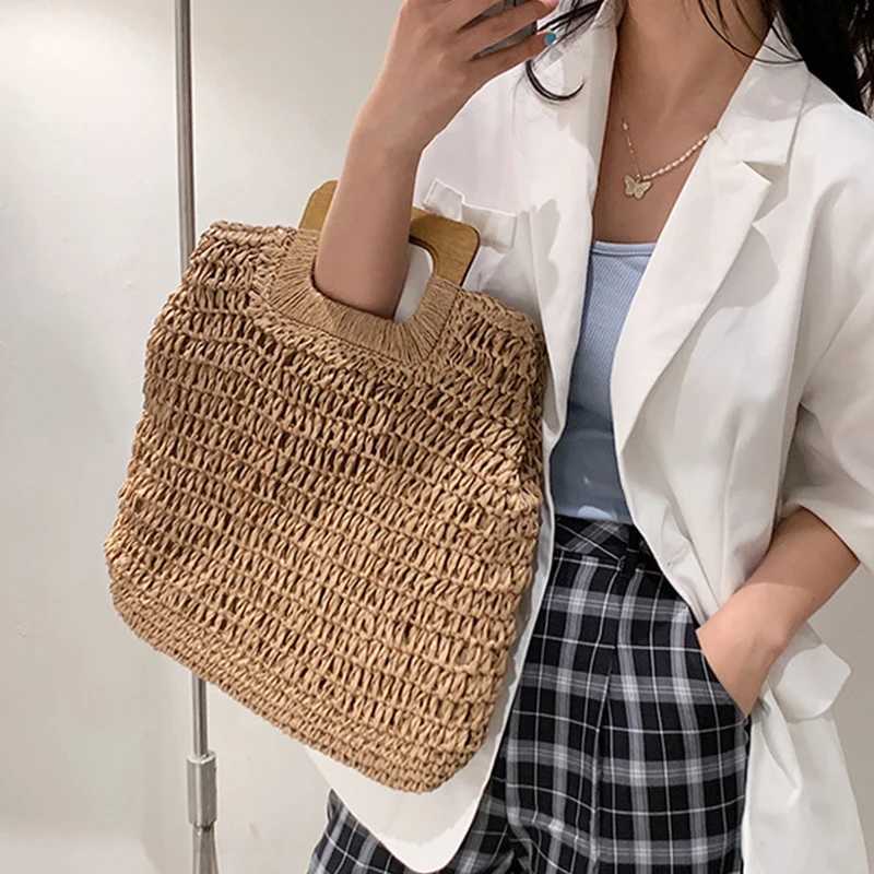 2025S Designer Summer Woven Str Handbag Female Wooden Handle Large Capacity Travel Beach Bag Fashion Style Totes Hollow out Tote BolsaC250222 Shoulder