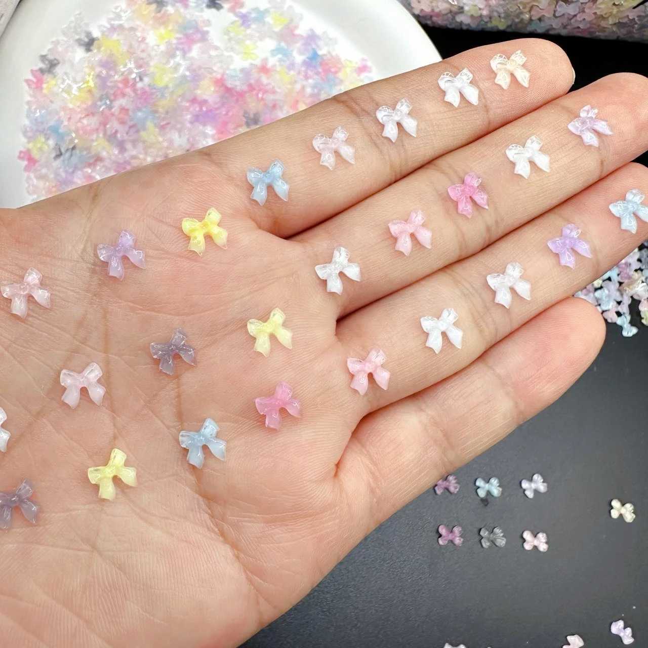 Nail Art Decorations 50pcs Transparent Bow Nail Art Parts Charms Bulk Shiny Mini Resin Ribbon Nail Rhinestones DIY Summer Nail Art Decor Accessories C