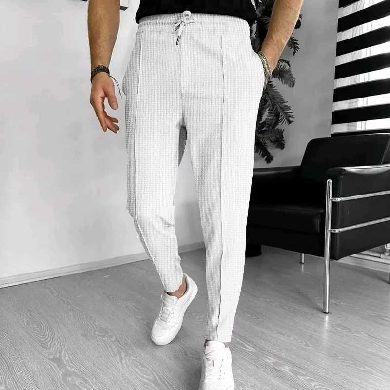 2024 Spring and Fall mens Waffle Leisure sports solid color pants trend fashion high quality drawstring small leg pants W250225