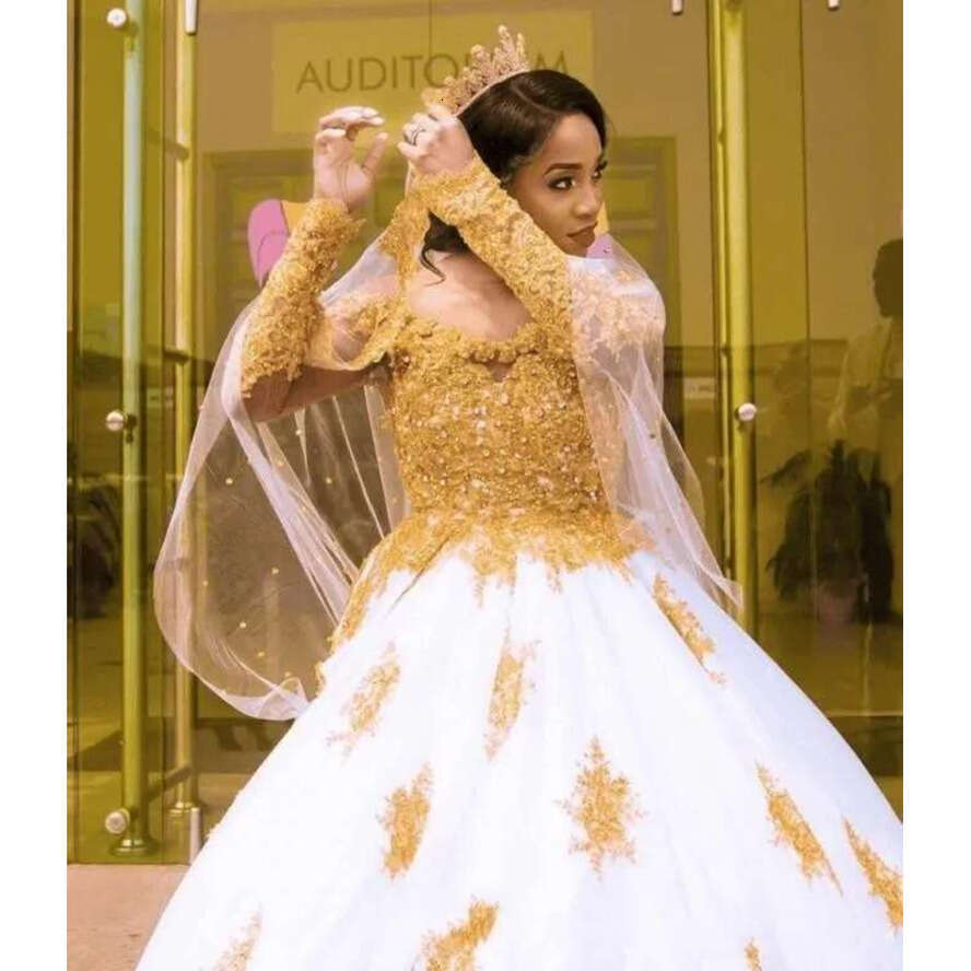 New African A E Wedding Dresses Off Shoulder Gold Lace Applique Beads Illusion Long Sleeves Backless Court Train Bridal Gowns
