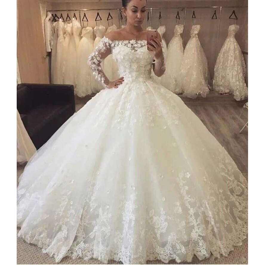 New Arabic A E Wedding Dresses Off Shoulder Illusion Lace 3D Appliques Long Sleeves Sweep Train Puffy Plus Size Formal Bridal Gowns