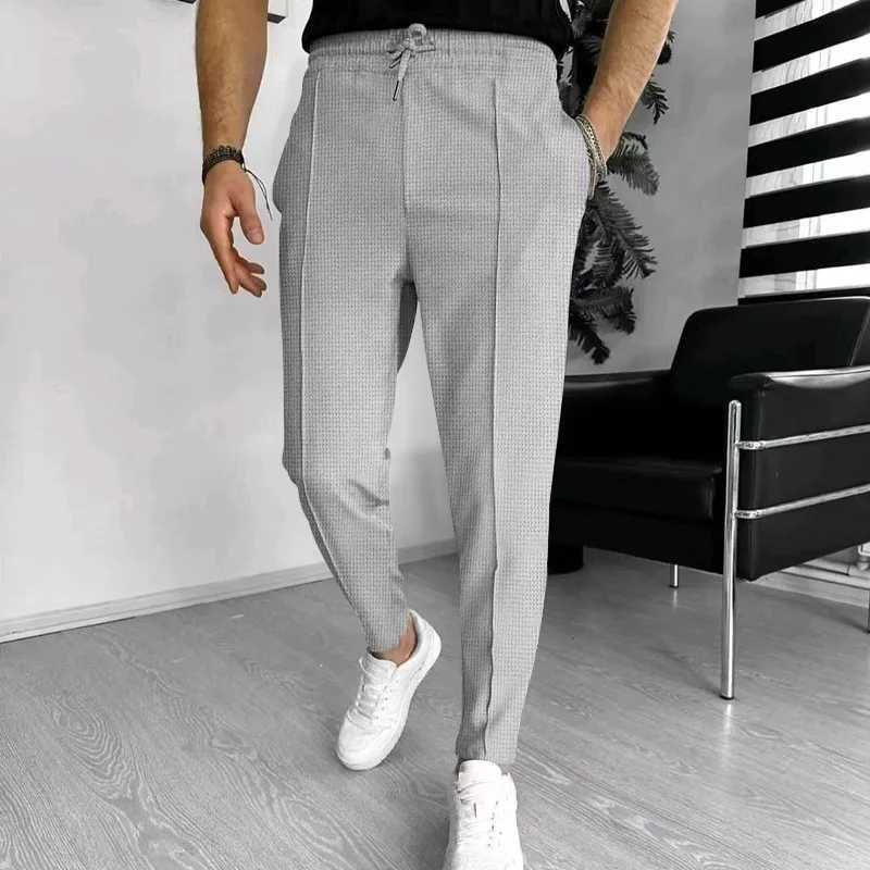 2024 Spring and Fall mens Waffle Leisure sports solid color pants trend fashion high quality drawstring small leg pants W250225