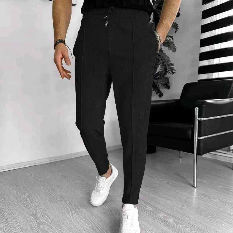 2024 Spring and Fall mens Waffle Leisure sports solid color pants trend fashion high quality drawstring small leg pants W250225