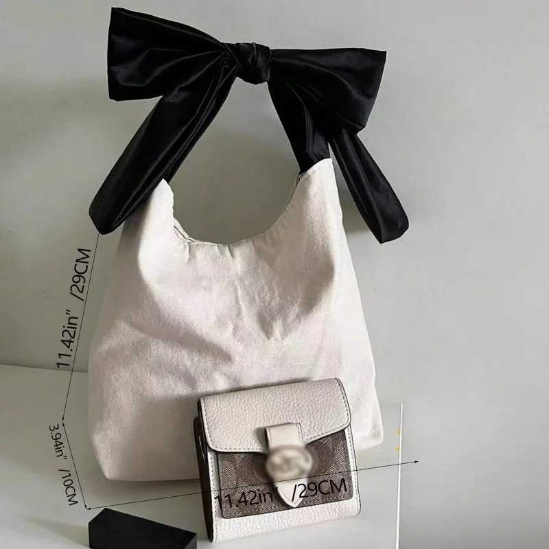 Womens shoulder bag contrasting color lace up large capacity handbag soft canvas handbag suitable for casual days Z250224