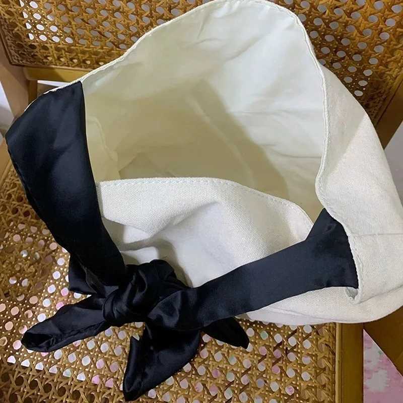 Womens shoulder bag contrasting color lace up large capacity handbag soft canvas handbag suitable for casual days Z250224