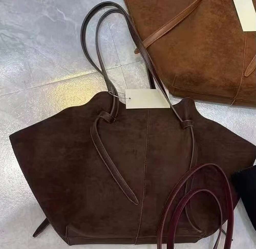 2024 Niche Design Wing Matte Cowhide Large Capacity Handheld Tote Suede Autumn And Winter Women's Shoulder Bag
