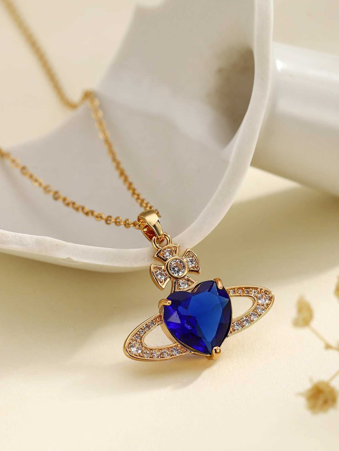 Pendant Necklaces Retro Saturn high-end fashionable copper inlaid synthetic zircon royal blue heart necklace J25021755EQ