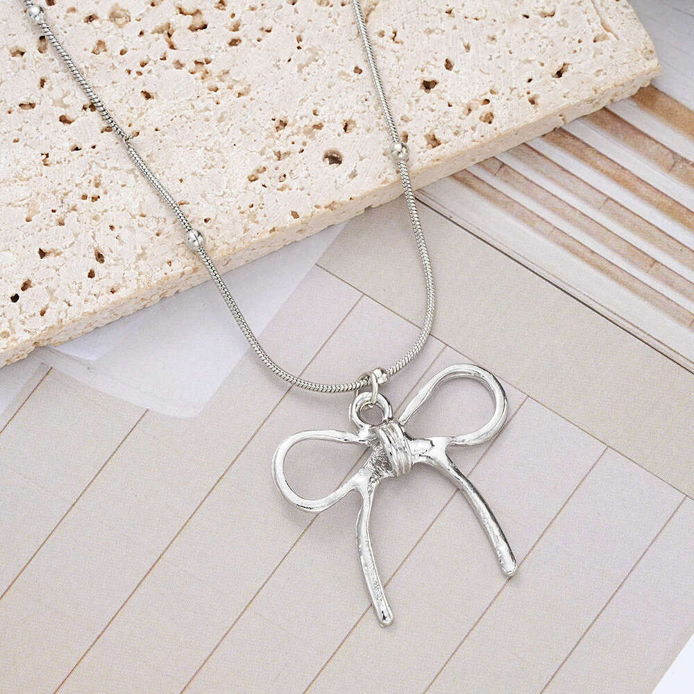 New light Instagram niche women's bow with high-end feel creative summer wear matching necklace