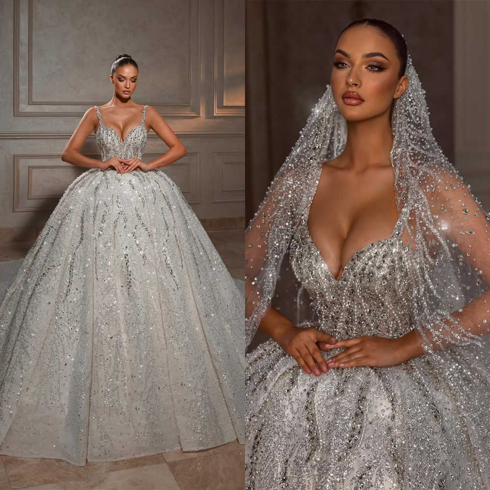 2025 New Designer Wedding Dresses Ball Gown Spaghetti Strap Lace Crystal Appliques Beads Sequins Floor-Length Court Gown Customized Bridal Gowns Vesti