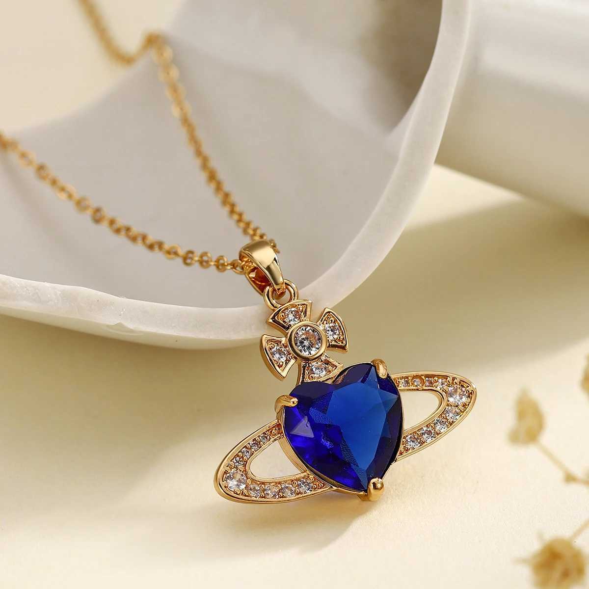 Pendant Necklaces Retro Saturn high-end fashionable copper inlaid synthetic zircon royal blue heart necklace J25021755EQ