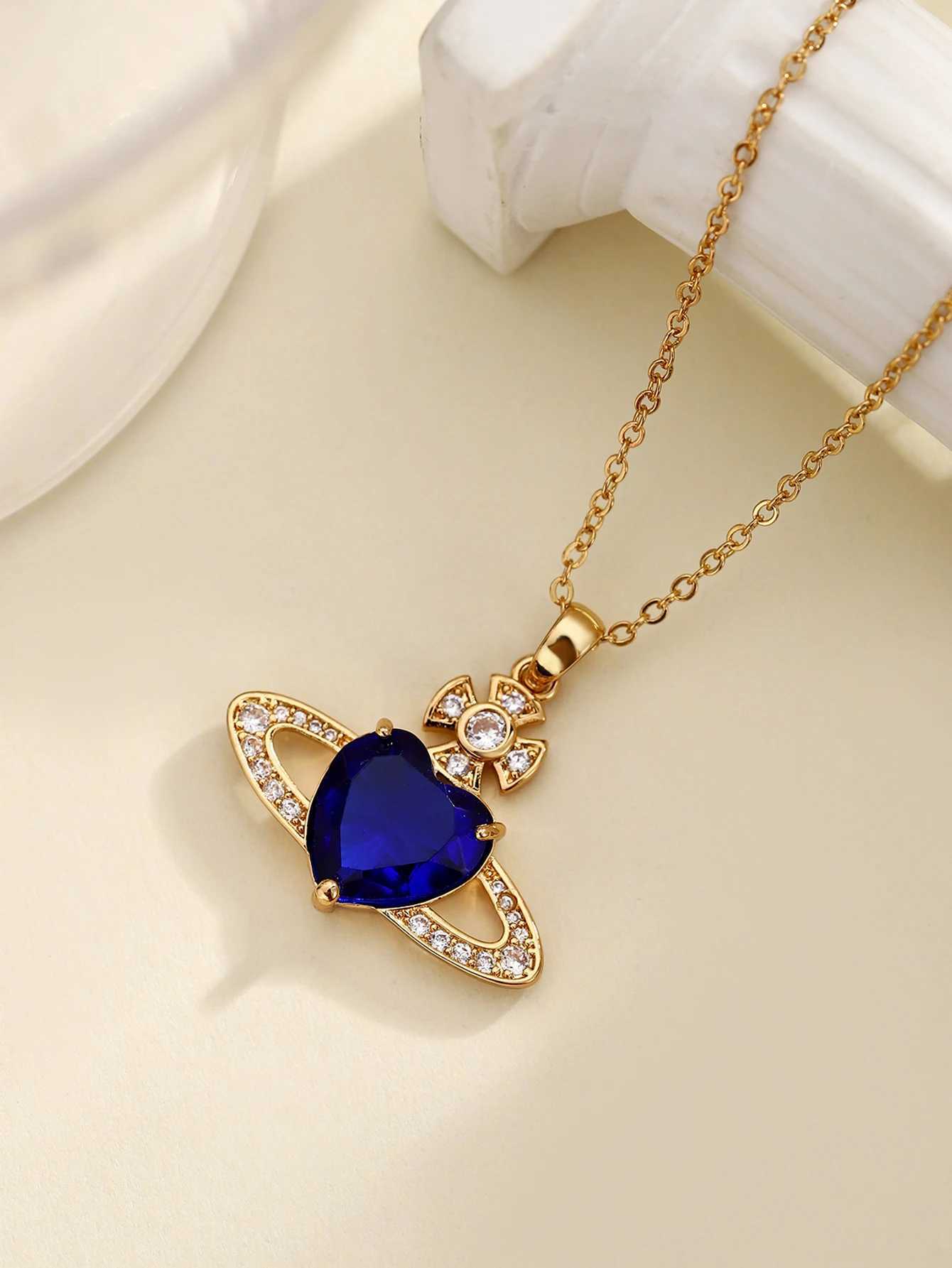 Pendant Necklaces Retro Saturn high-end fashionable copper inlaid synthetic zircon royal blue heart necklace J25021755EQ