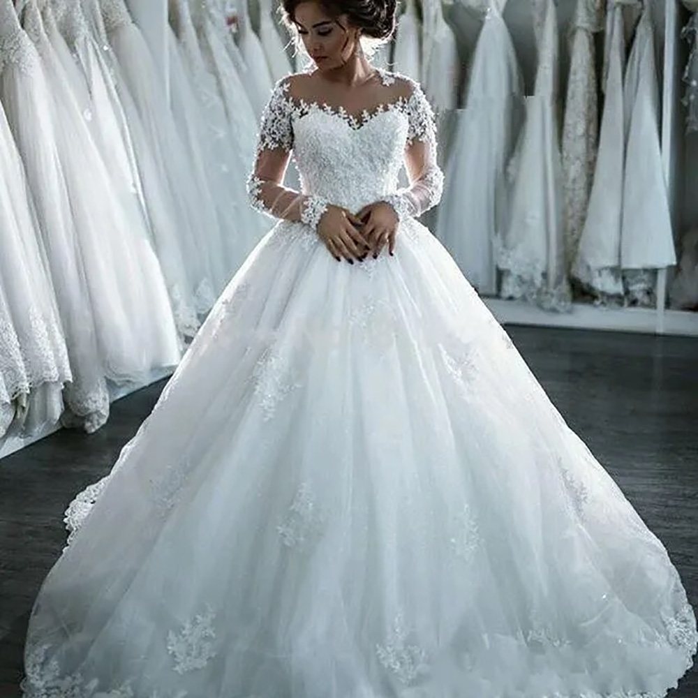 A-line Wedding Dresses Dubai Long Sleeves Gowns Sheer Crew Neck Lace Appliques Beaded Vestios De Novia Bridal Gowns with Buttons