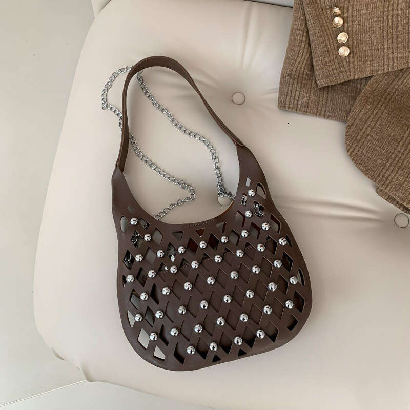 Small niche design for women hollowed out starry sky commuting armpit bag, fashionable rivet single shoulder crossbody bag 2024 new style, chic and el