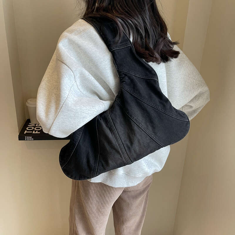 Korean version popular fashion denim shoulder for women, spicy girl, niche casual commuting armpit bag wholesale, 2024 temperament versatile new trend