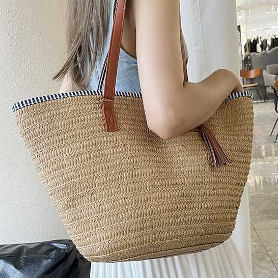 Relaxing large capacity woven bag for women in spring 2025, fashionable and versatile vacation beach bag, hand-held vegetable basket bag