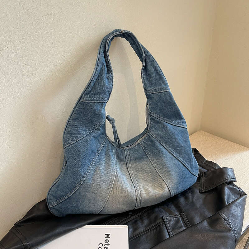Korean version popular fashion denim shoulder for women, spicy girl, niche casual commuting armpit bag wholesale, 2024 temperament versatile new trend