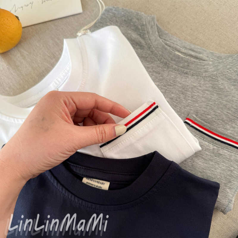 T-shirts Childrens T-shirt 2025 Spring Korean Edition Boys and Girls Western Style Light Plate Pocket T-shirt Baby Casual Solid Color Bottom Shirt Tre