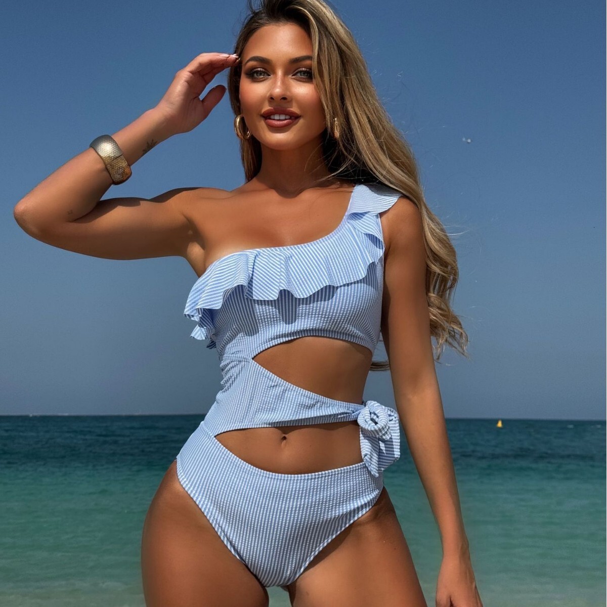 New one-piece with ruffled edges, hollowed out lace up for women, high-end feeling, soaking in hot springs, striped designer bikini swimwear