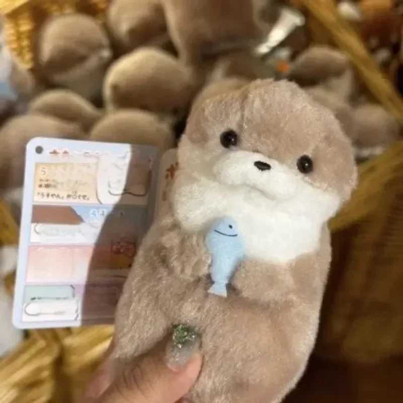 Free shipping 2024 New Cute Otter Holding Fish Plush Ring Lightweight Hanging Pendant Prop Used for School Bag Key Wallet Doll Toy Gift