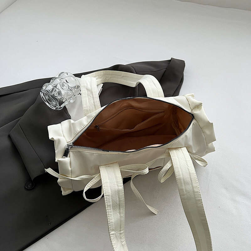 Japanese and Korean minimalist cute style large capacity casual canvas shoulder for women pleated lace commuting armpit bag 2024 temperament versatile