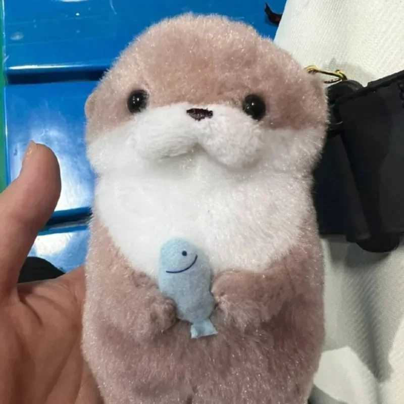 Free shipping 2024 New Cute Otter Holding Fish Plush Ring Lightweight Hanging Pendant Prop Used for School Bag Key Wallet Doll Toy Gift